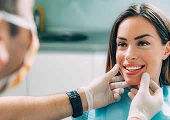 A dentist evaluating a patient’s cost of cosmetic dentistry in Columbia