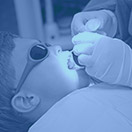 Child receiving dental care blue highlight