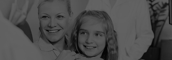 Smiling mother and daugther black and white