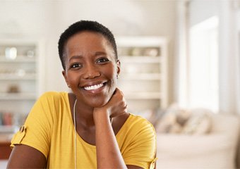 Woman smiling with dentures in Columbia