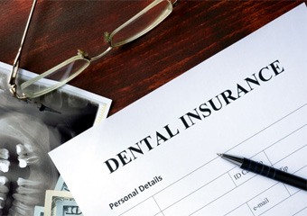 Dental insurance paperwork lying on desk