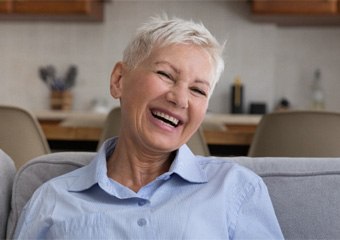 Woman with dentures in Columbia smiling
