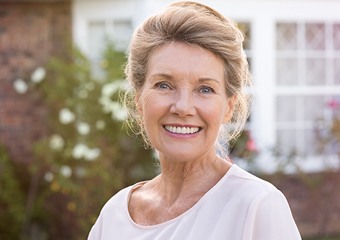 Smiling older woman outdoors