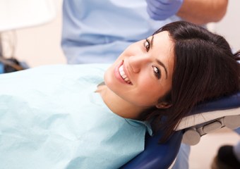 Woman in dental chair smiling