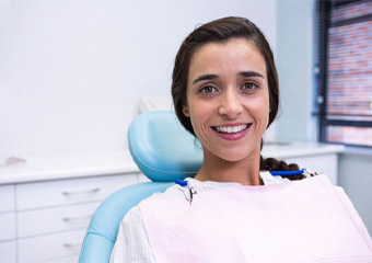 Female patient smiling after root canal therapy in Columbia, TN