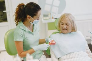 Woman at dentist for dentures in Columbia