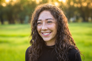 a patient smiling during the summertime