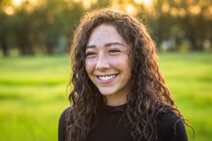 a patient smiling during the summertime 