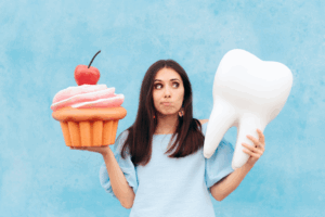 a person thinking about how sugar affects their teeth 