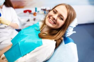 Woman smiling after getting a root canal treatment